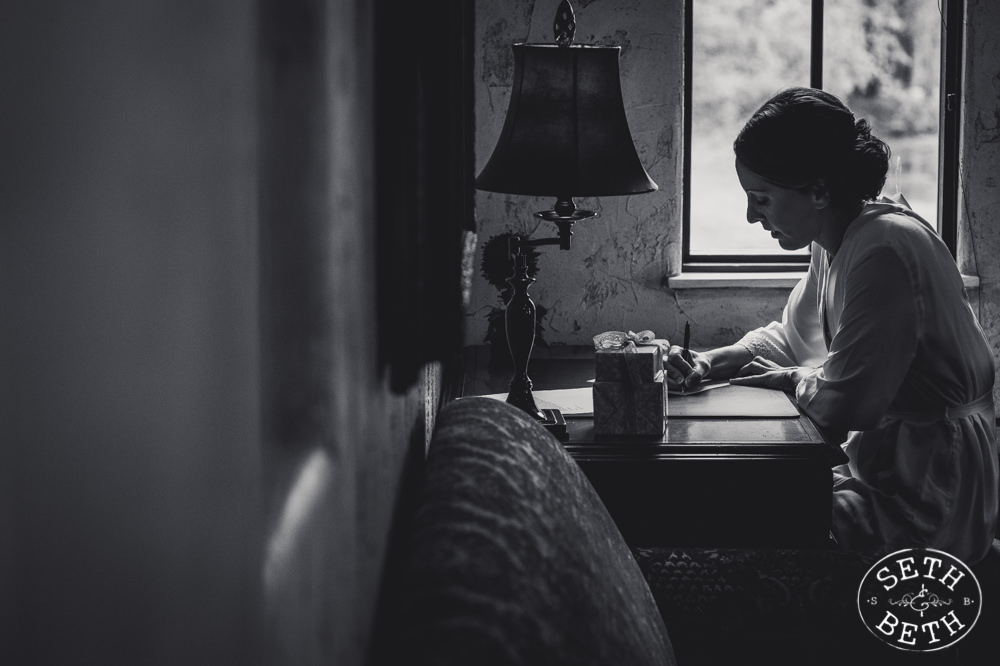 A bride writing a letter at a Gervasi Vineyard Wedding