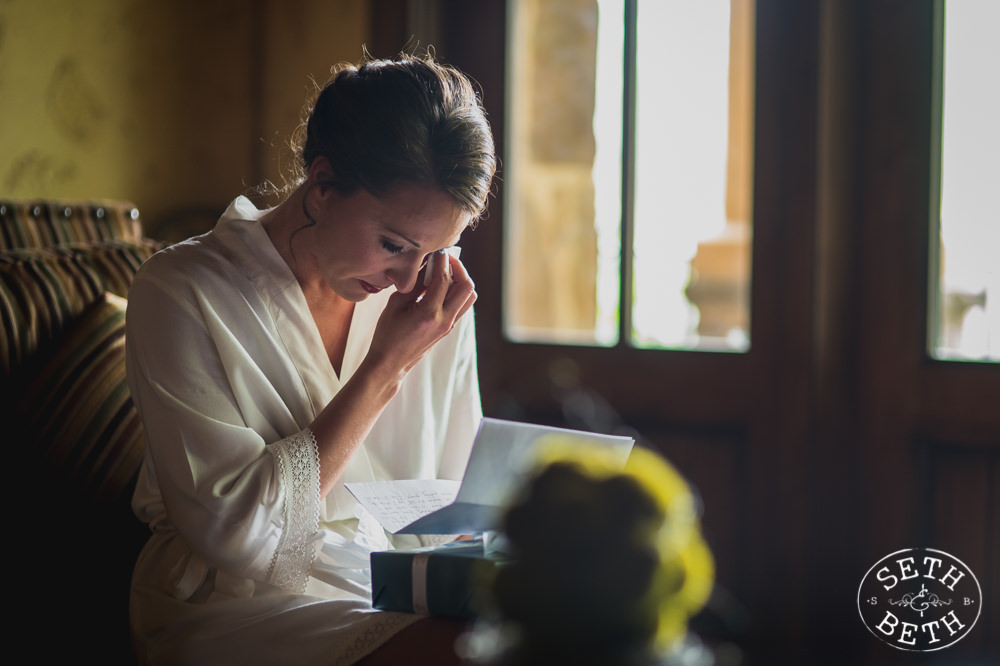 A bride reading a letter at a Gervasi Vineyard Wedding