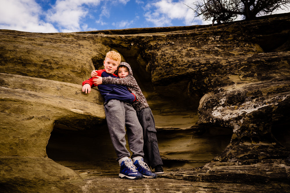 Planning your epic Utah family vacation. Two brothers play in Utah caves