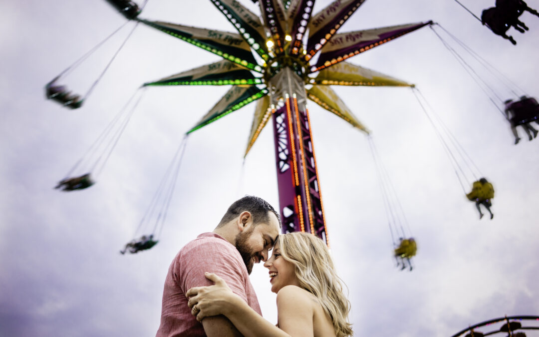 Bride and Groom hugging and smiling at the Yoyo ride during the Ohio State Fair