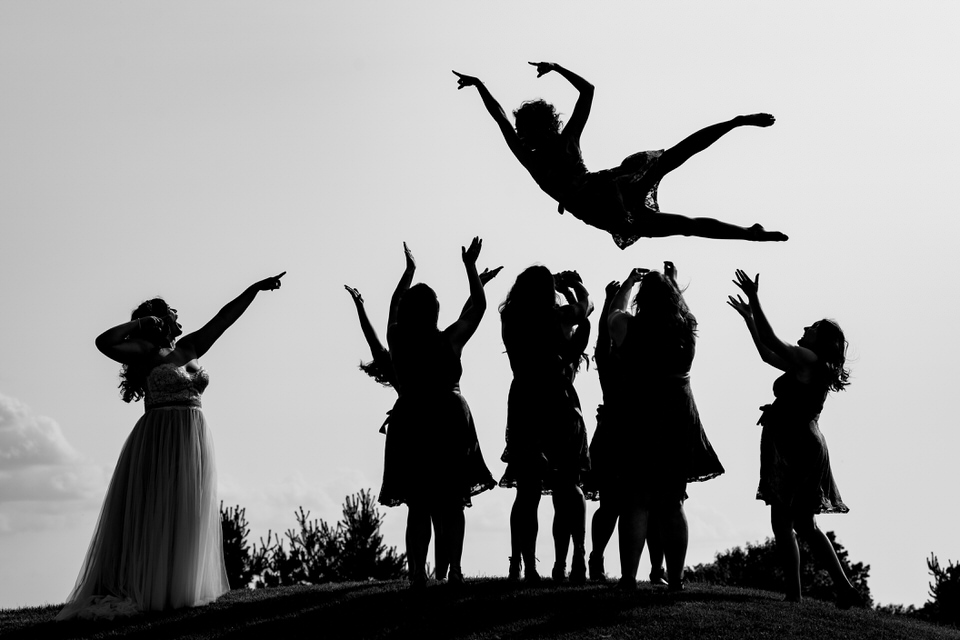 Bridesmaids throw another bridesmaids in the air in Columbus, Ohio