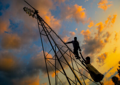 Alum Creek Farm Wedding bride and groom climb windmill at sunset