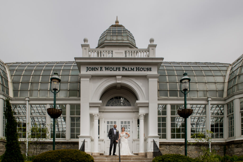 bride and groom outside Beautiful Botanical Garden