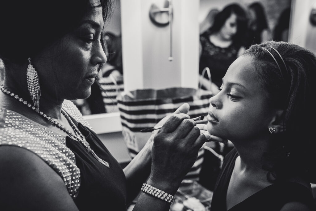 flower girl getting makeup on at Beautiful Botanical Garden Wedding 