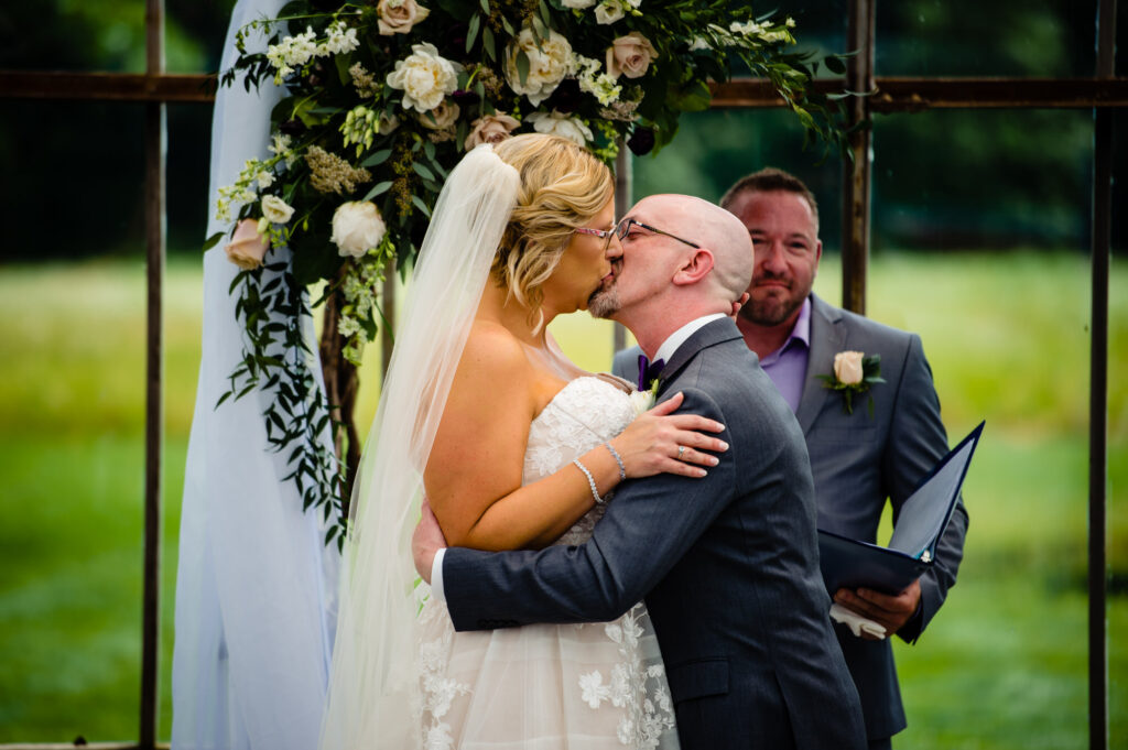 kissing bride and groom