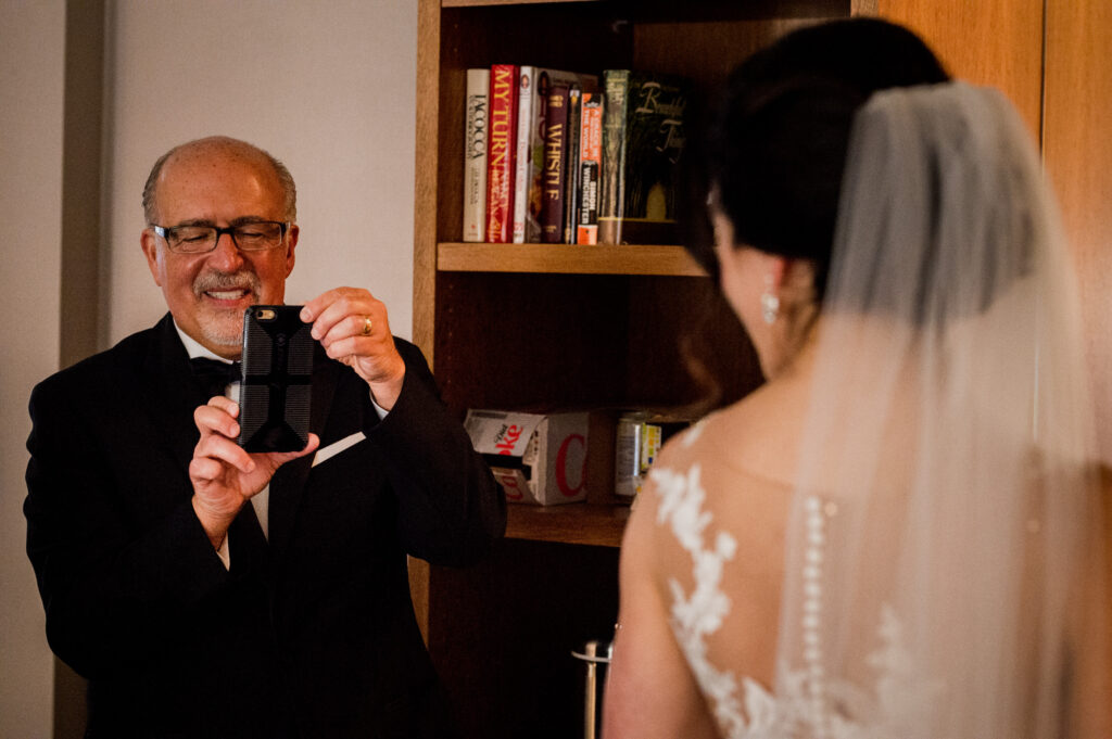 proud father taking picture of bride for Columbus Ohio Westin Wedding