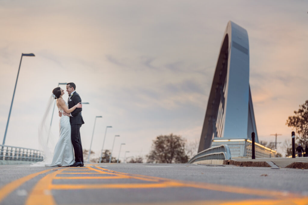 bride and groom on a bridge