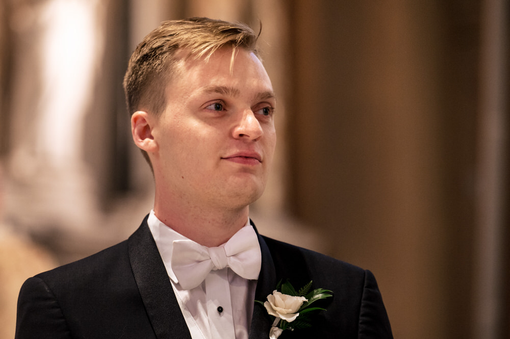 Groom watching his bride walk down the aisle at Saint Bernard's in Akron Ohio