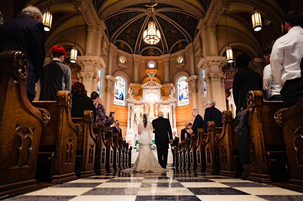 Bride walking down the aisle of Saint Bernard's