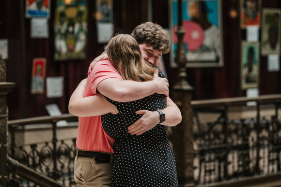 Gigi hugging Gabe after their surprise proposal