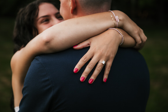 Bride-to-be showing her engagement ring after her proposal