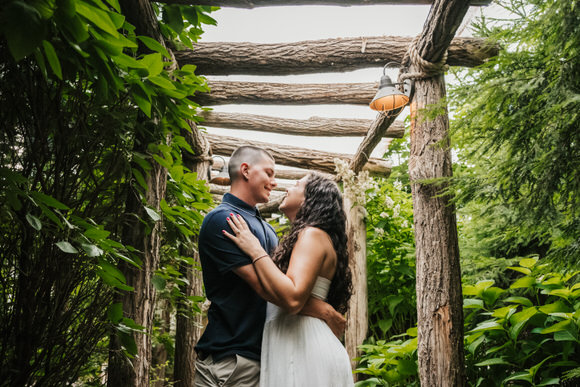Couple embracing after a surprise winery proposal
