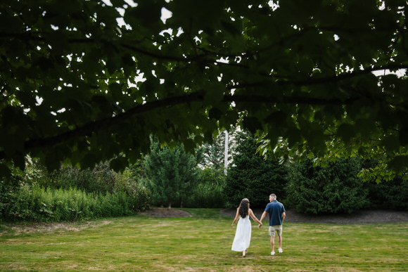 Gionna and Corey celebrating their engagement in the winery gardens