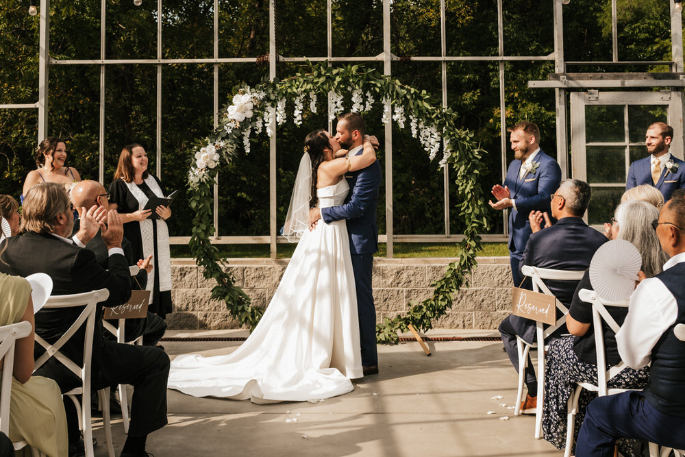 Romantic greenhouse wedding ceremony at Alum Creek Farm