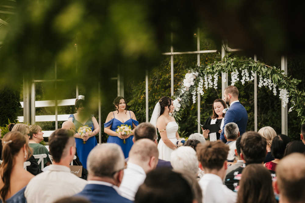 Romantic greenhouse wedding ceremony at Alum Creek Farm