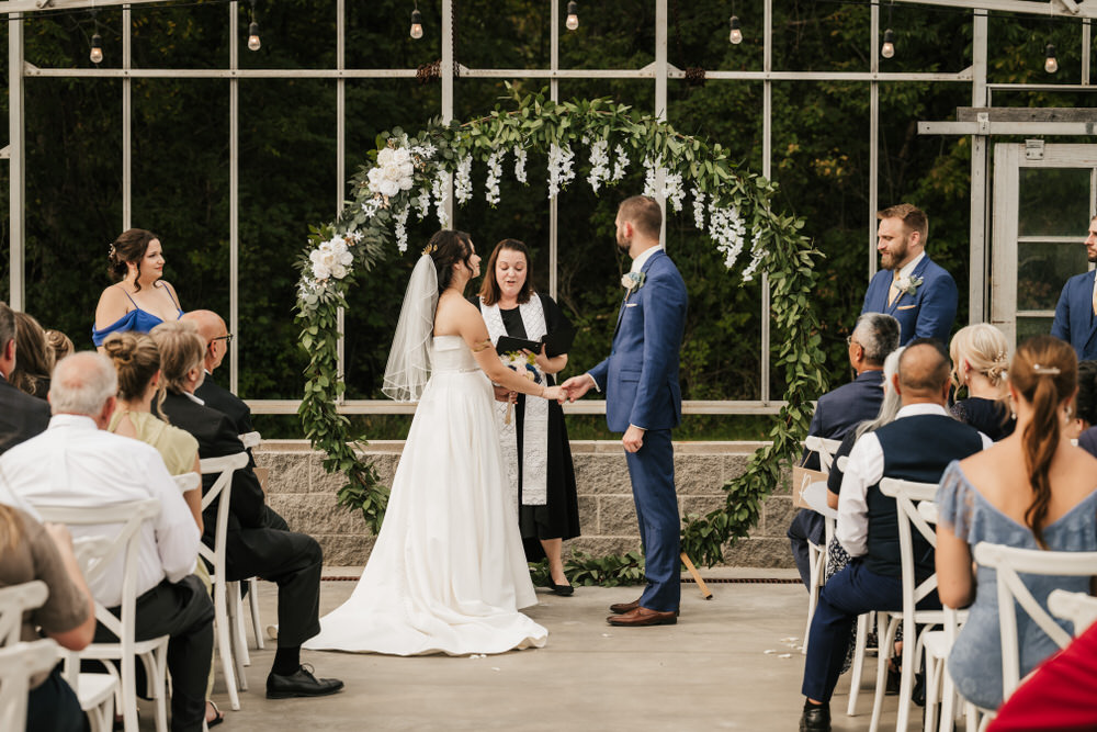 Romantic greenhouse wedding ceremony at Alum Creek Farm