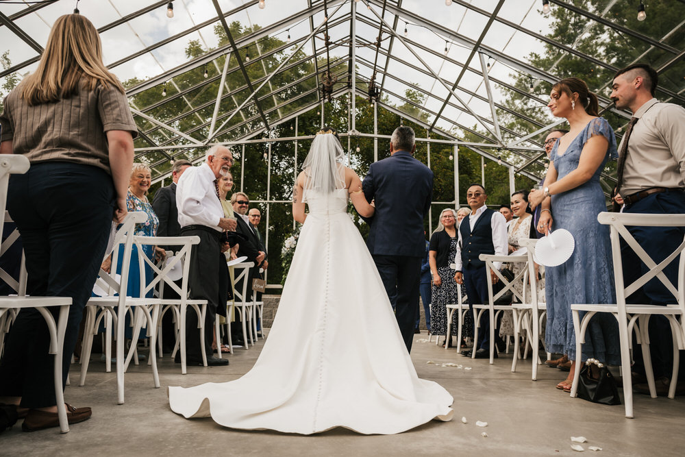 Romantic greenhouse wedding ceremony at Alum Creek Farm