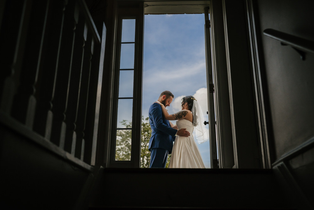 Ashley and Matt exchanging vows in the greenhouse