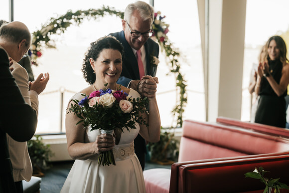 Mark and Julia celebrating their wedding at Pier W